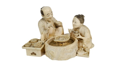 Japanese Okimono Group Carving of a Couple Eating and Drinking with Hibachi and Food, Early 20th