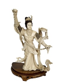 Chinese Carving of a Mythical Lady with Ball and Chain, Early 20th Century, mounted to a wood stand,