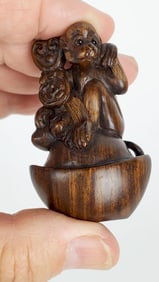 Japanese Exotic Hardwood Carved Netsuke of a Monkey with glass eyes, 2 1/4" x 1 1/2"