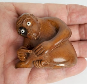 Japanese Boxwood Carved Monkey Netsuke with glass eyes, underside marked, 1 1/2" x 1 3/4"