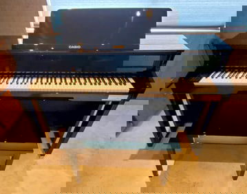 Casio Celviano Electric Piano and Bench, c. Bechstein Edition, in like new condition, 37" h. 56 1/4"