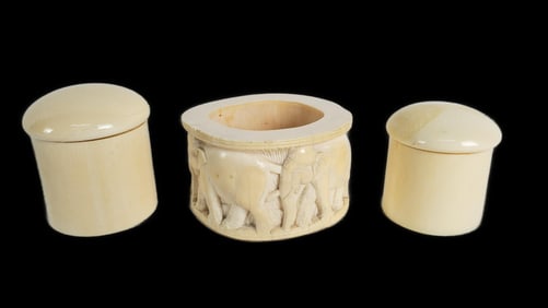 Group of Three Carved Objects to include: an African open vessel with carved with a procession of
