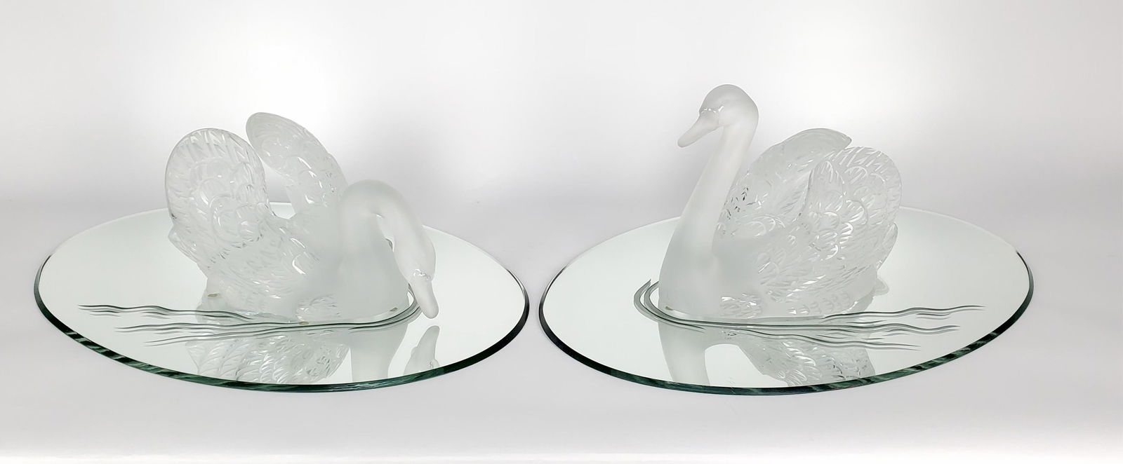 Pair Lalique Crystal Swans on Mirrored Plateaus,each signed Lalique, France, good condition, no