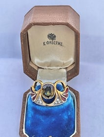 Antique Russian 14K Gold Ladies Ring set with a center Dementoid Garnet stone flanked with