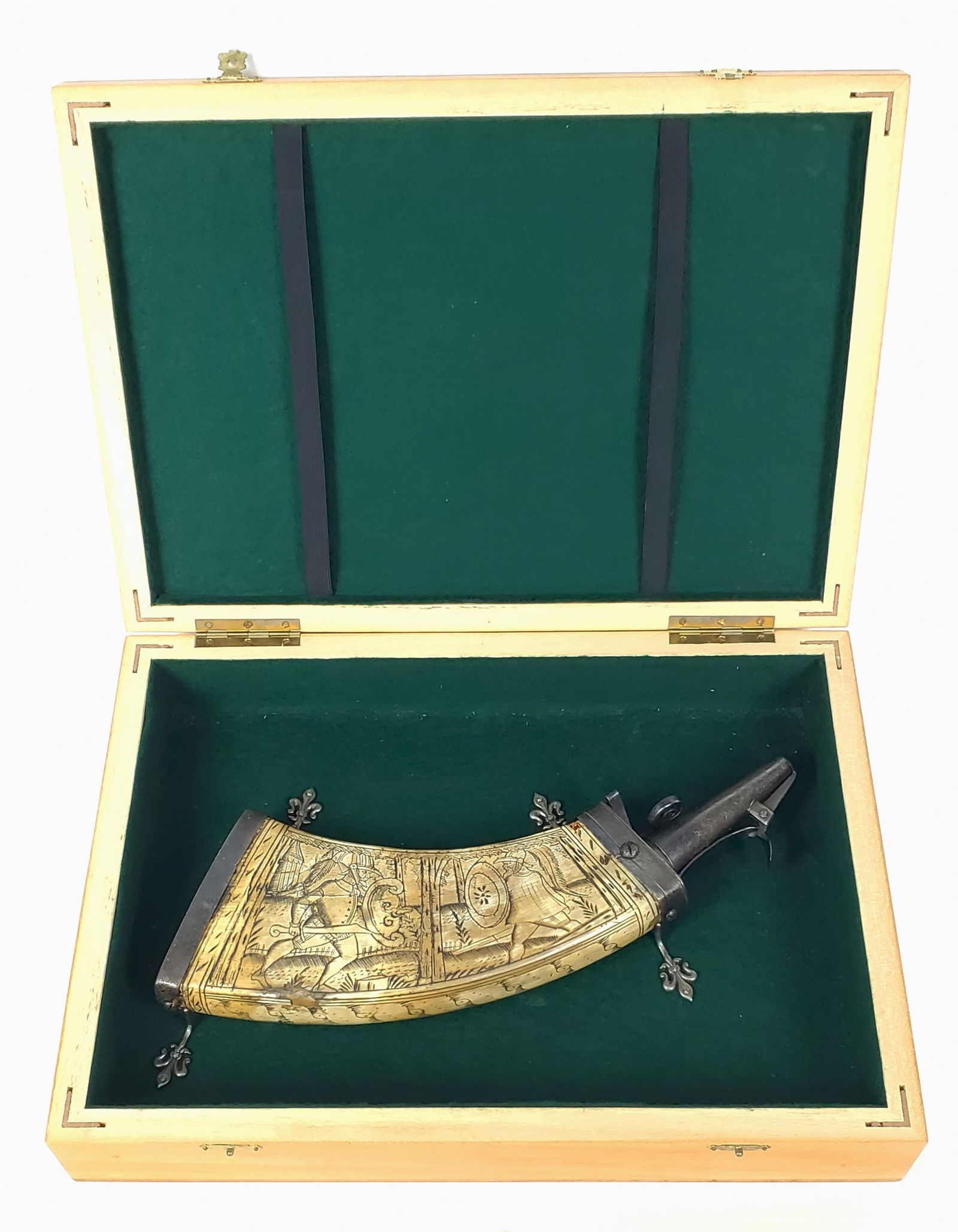 A German 17th Century Bone and Metal Mounted Powder Horn, circa 1600-20, etched with a scene of two: A German 17th Century Bone and Metal Mounted Powder Horn, circa 1600-20, etched with a scene of two men battling, 11 3/4" L. 4" w. 1 1/2" d., in a fitted presentation wood box and accompanied by a let