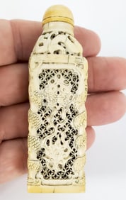 Antique Chinese Carved and Pierced Snuff Bottle with Lucky Symbols, 3" h. 1" w. 1/2" d.