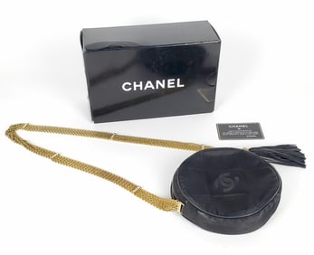 Chanel Quilted Ladies Purse with gold chains strap and tassel, accompanied with the Chanel