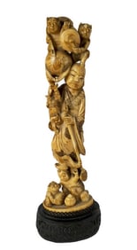 Japanese Carved Okimono of Rakan and Bakeneko, mounted to a pierced metal base, 10 1/2" h.3 1/4" w.