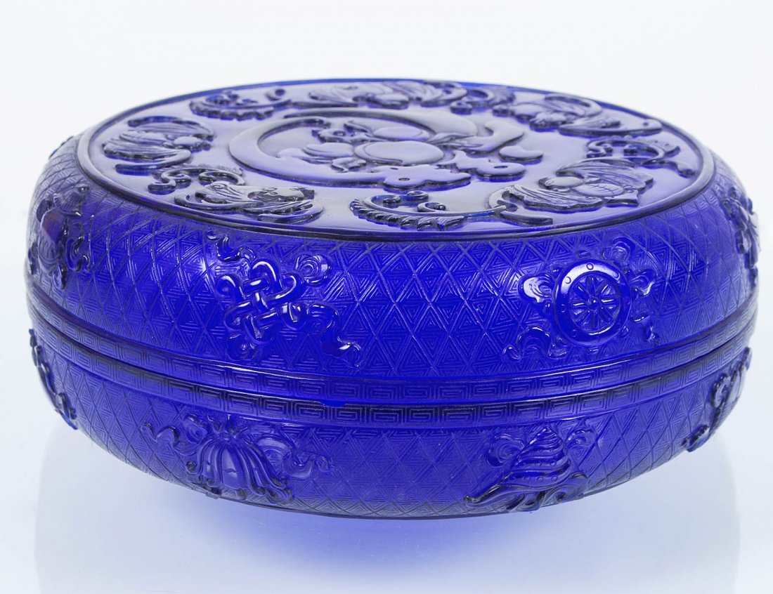 BLUE PEKING GLASS WEDDING BOX AND COVER: Chinese. Signed. Of circular form, decorated with bats, peaches and other symbols. Diameter 9 1/8". (Cond: chip to inside rim) (400/600)