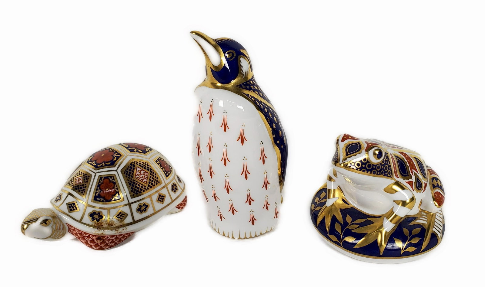 Three Royal Crown Derby Porcelain Figures to include: Penguin, Frog, and Turtle, all marked: Three Royal Crown Derby Porcelain Figures to include: Penguin, Frog, and Turtle, all marked underside, 5 14" h. 3" h. 1 3/4" w., good condition, no chips, blemishes, or imperfections.