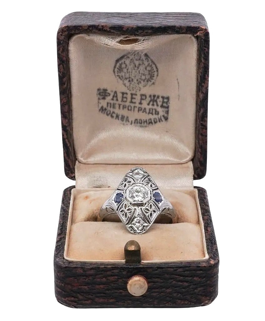 Russian Antique 14K Gold and Platinum Ladies Ring: Russian Antique 14K Gold and Platinum Ladies Ring set with a center diamond stone ( (approx. 1 carat ) with two additional diamond and sapphire points, marked 56 with maker marks, total weight 4.29 gr