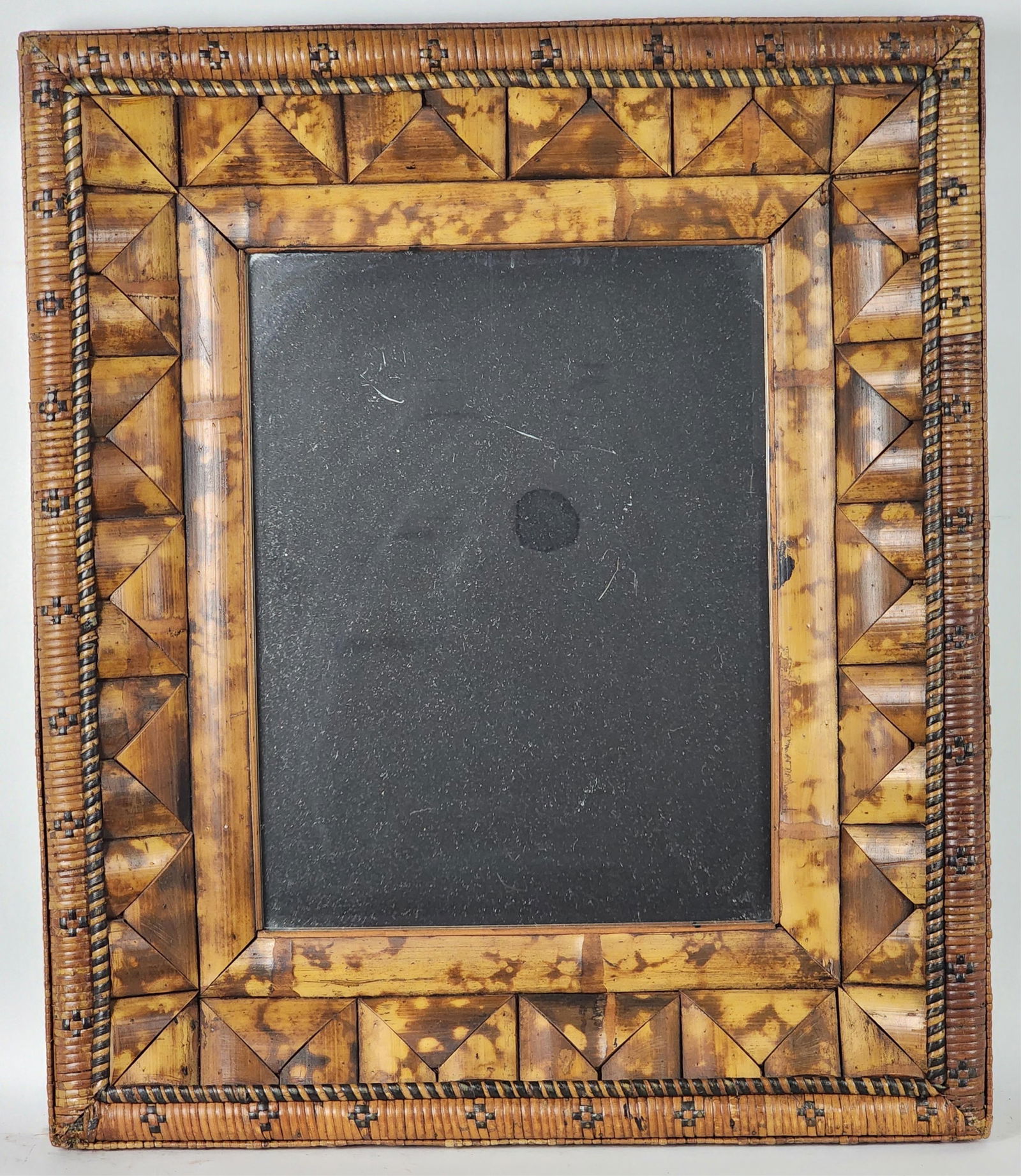 A Vintage Rattan and Wrapped Bamboo Mirror, 20th Century, 27 5/8" x 23 1/2", some light wear from: A Vintage Rattan and Wrapped Bamboo Mirror, 20th Century, 27 5/8" x 23 1/2", some light wear from age and use.