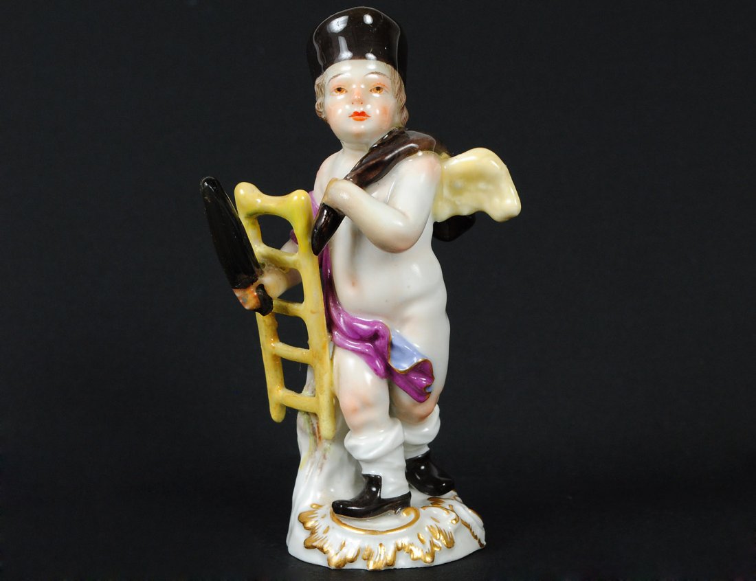 MINIATURE MEISSEN PORCELAIN FIGURE: German. 20th Century. Underglazed blue crossed swords and impressed 111Q. Of a cherub carrying a ladder and sack. Height 4 1/8”. (150/200)