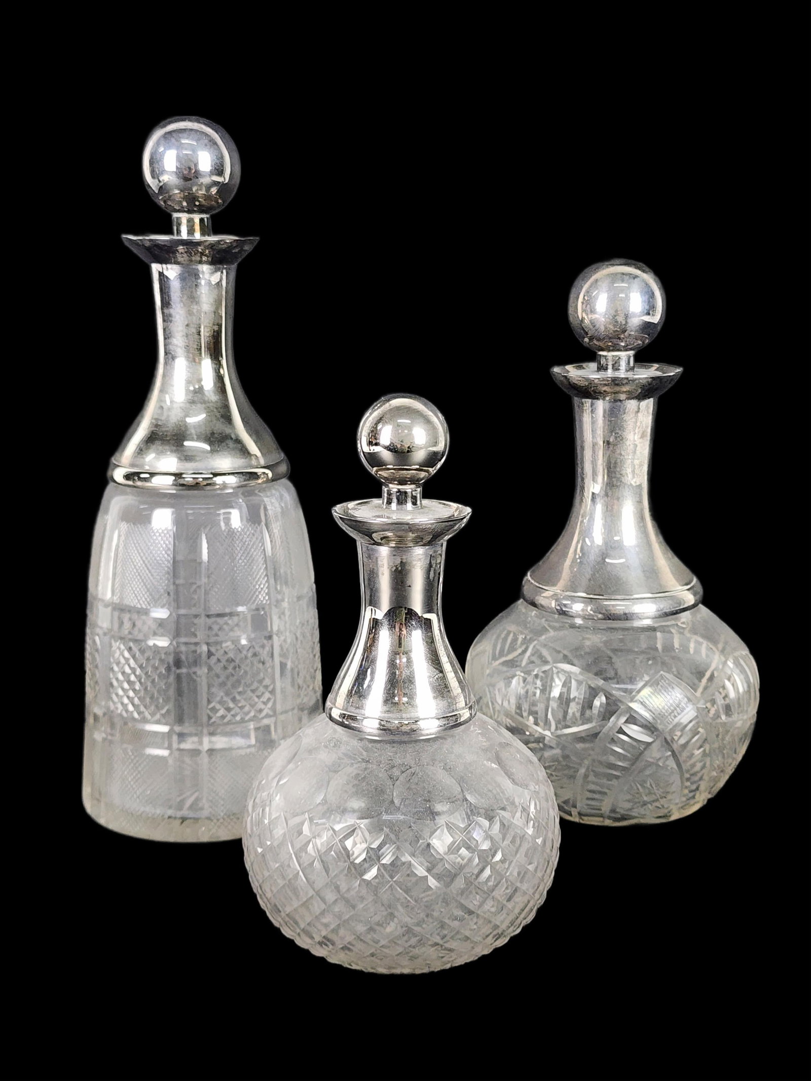 Three Antique Cut Glass Decanters with Silver-plated Collars and Stoppers, no marks, 12" h. 9 1/2" (1 of 4)