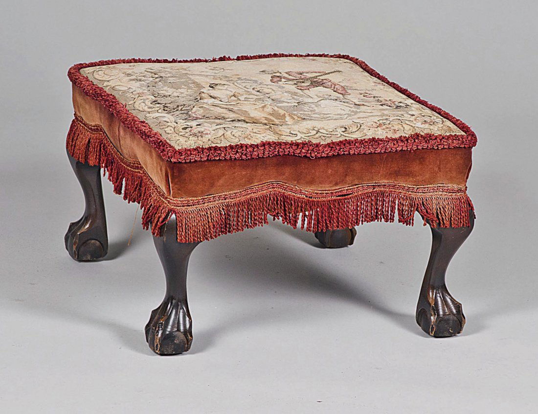 GEORGE III STYLE MAHOGANY FOOT STOOL: The machine made tapestry upholstered top raised on short cabriole legs ending in claw and ball feet. Height 13". Width 20". Depth 20". (100/500)