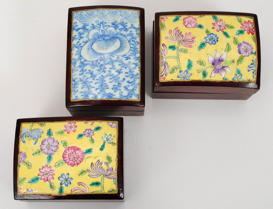 GROUP OF THREE PORCELAIN AND WOOD BOXES AND COVERS: Chinese. Each of rectangular shape with porcelain inset cover. Length 4 3/4". (100/500)