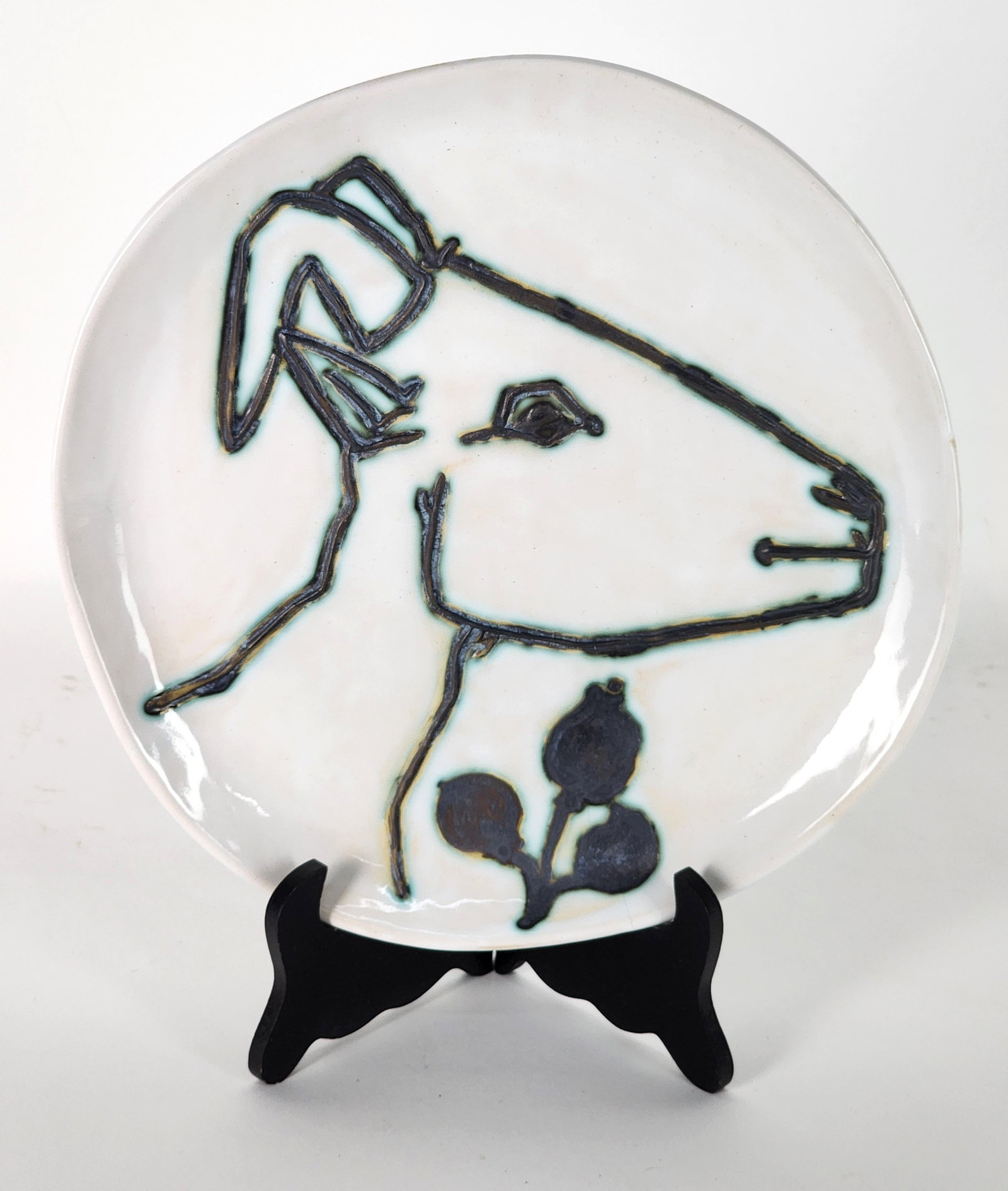 Pablo Picasso (Spanish, 1881-1973) Tete de Chevre Profil, Madoura Ceramic Plate, back with impressed: Pablo Picasso (Spanish, 1881-1973) Tete de Chevre Profil, Madoura Ceramic Plate, back with impressed mark, 9 3/4" dia., has hairline crack.
