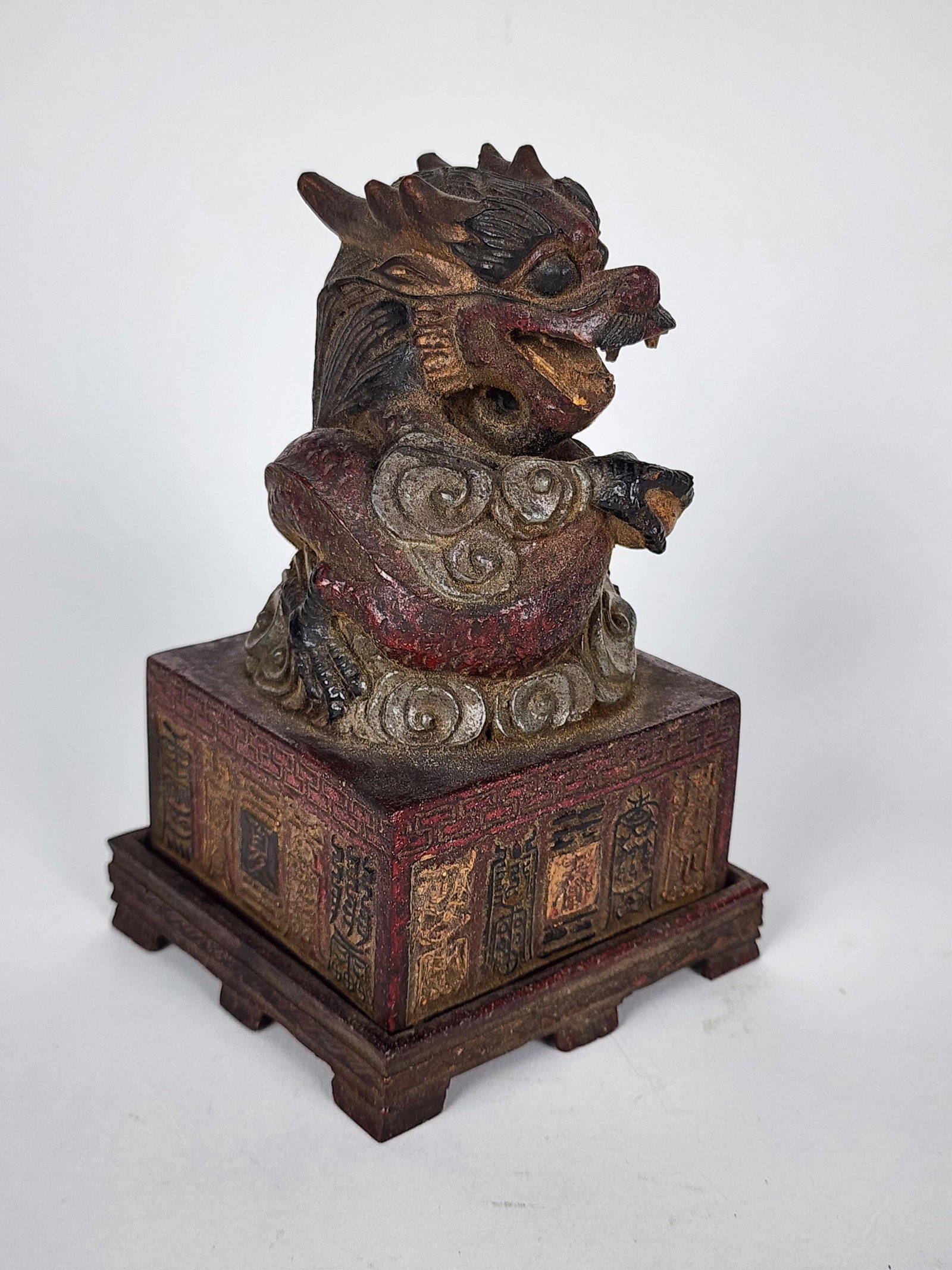 Chinese Carved Wood Dragon Seal on Stand, Qing, the seal carved with sixteen character marks, on: Chinese Carved Wood Dragon Seal on Stand, Qing, the seal carved with sixteen character marks, on footed conforming base, 7" h. 4" w. 4" d.