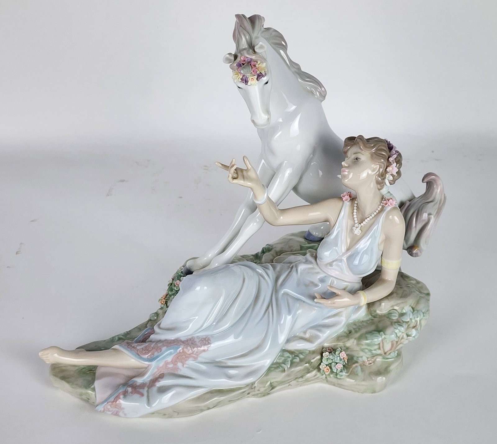 Lladro Porcelain Figure of a Lady with Unicorn, underside marked, 10 1/2" h. 13 1/2" L. 7 1/2" d., (1 of 5)