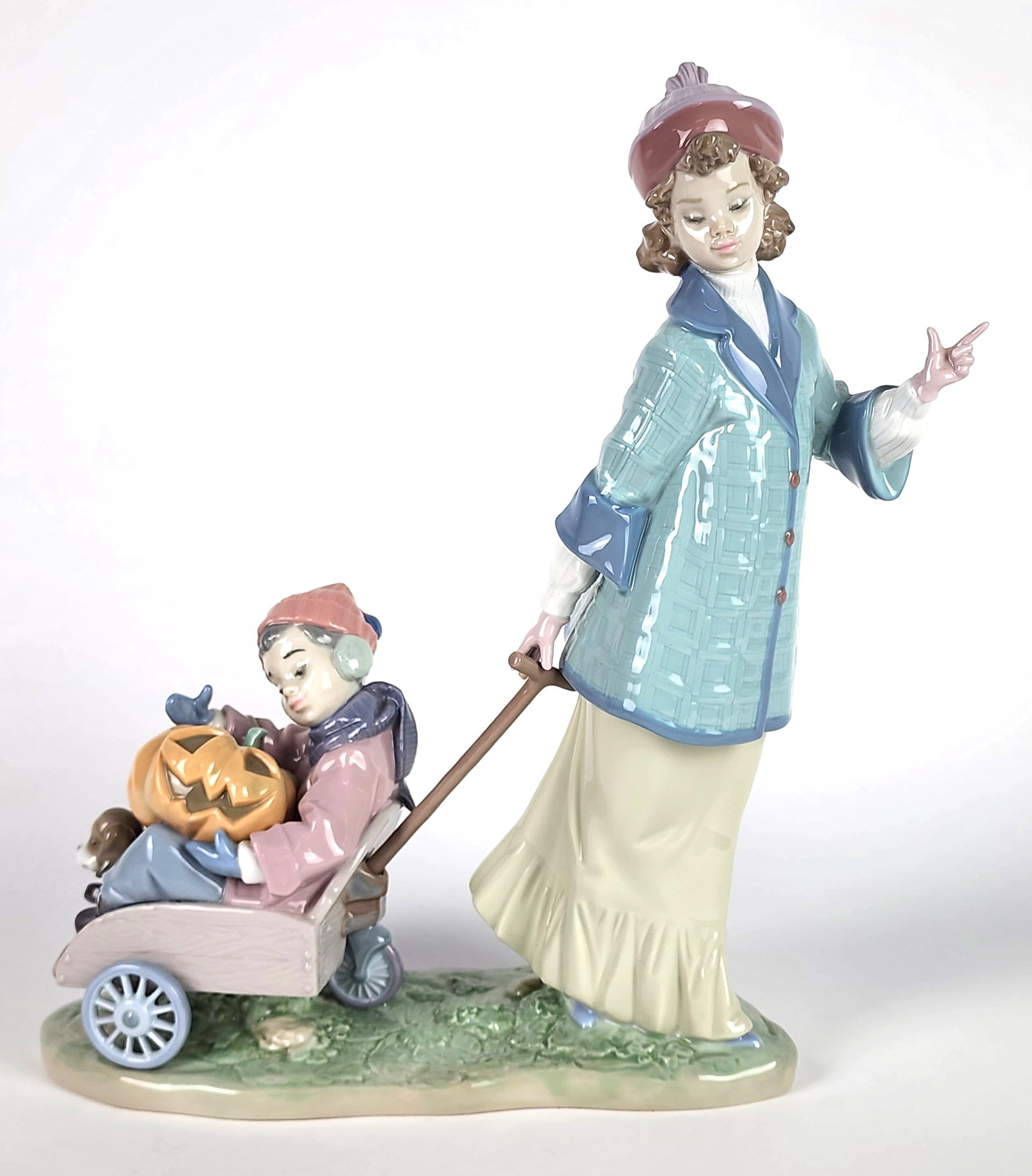 Lladro Porcelain Figure of a Boy and Girl at Halloween, underside marked, 12 1/2" h. 9 1/2" w. 4" d.: Lladro Porcelain Figure of a Boy and Girl at Halloween, underside marked, 12 1/2" h. 9 1/2" w. 4" d.