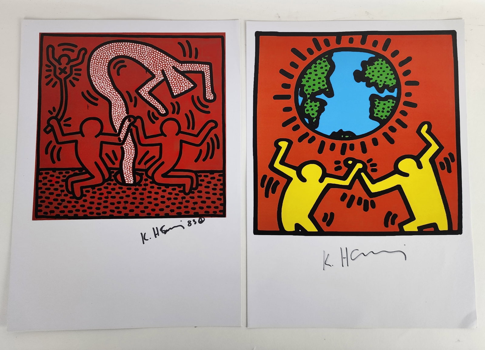 Two Keith Haring American, 1958-1990)Two Pop Shop Color Prints, both signed in black marker, with: Two Keith Haring American, 1958-1990)Two Pop Shop Color Prints, both signed in black marker, with the certification stamps, 17 1/4" x 12 1/2", loose and unframed.