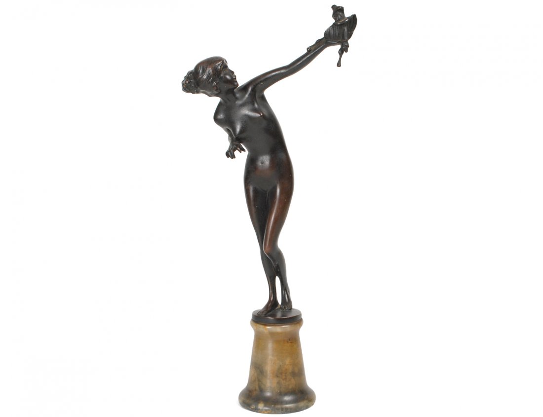HELLA UNGER (Austrian. 20th Century): "Nude with Puppet". Signed. No. 130/304 and stamped "Made in Austria". Bronze with Brown Patina. Mounted on an onyx base. Height 14". (400/500)