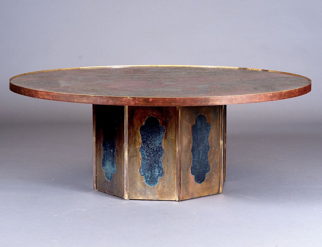 LAVERNE BRONZE AND PEWTER LOW TABLE: American. Circa 1970. In the "Ming" pattern. The circular top raised on a paneled pedestal. Height 17 3/4".Diameter 47 1/2". (3500/4500)