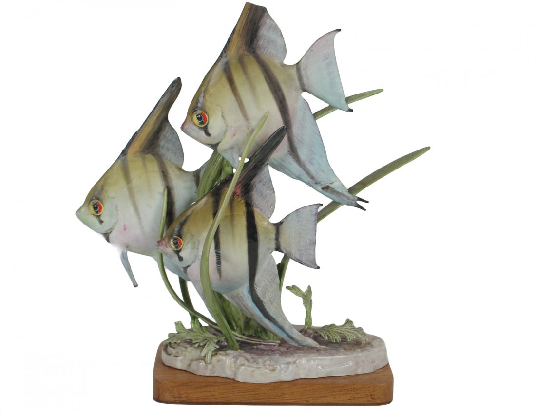 ROYAL WORCESTER PORCELAIN "ANGEL FISH": English. Designed by D. Lindner in 1951. Height 10". With wood stand. (Cond: loss to fish and foliage) (100/150)