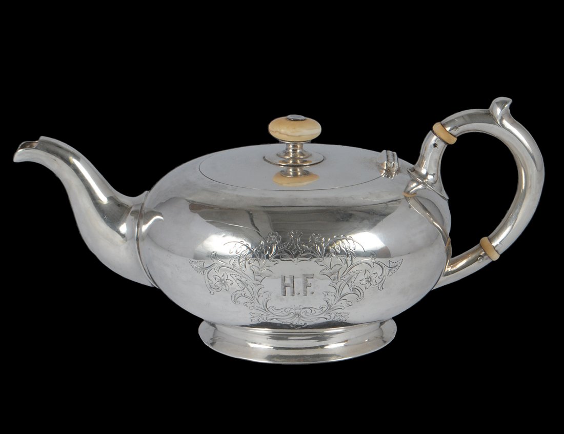 RUSSIAN SILVER TEAPOT: Moscow. Dated 1886. Assayer: A.P. in Cyrillic. Maker: Nemirov-Kolodin. Engraved with monogram H.F. in floral shield.(.84 Standard.) Height 4". (13 oz) (400/500)