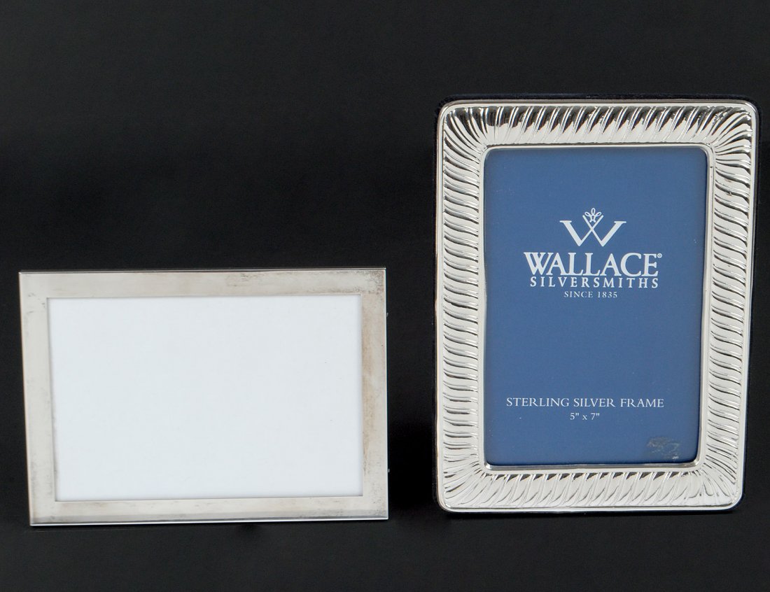 TWO STERLING SILVER PHOTOGRAPH FRAMES: American. The first by Wallace. Measuring 8 1/2" by 6 1/4". The second by Web. Measuring 7 1/8" by 5 1/8". (150/200)
