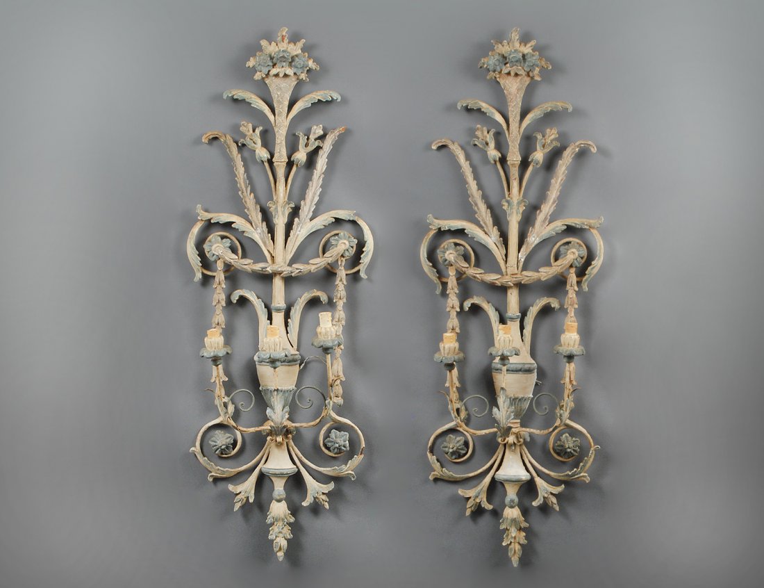 PAIR OF CARVED AND POLYCHROME WOOD THREE LIGHT SCONCES: Italian. 20th Century. Each vase form backplate issuing flowering branches and scrolls. Height 46". (Cond: restoration, loose parts) (500/700)
