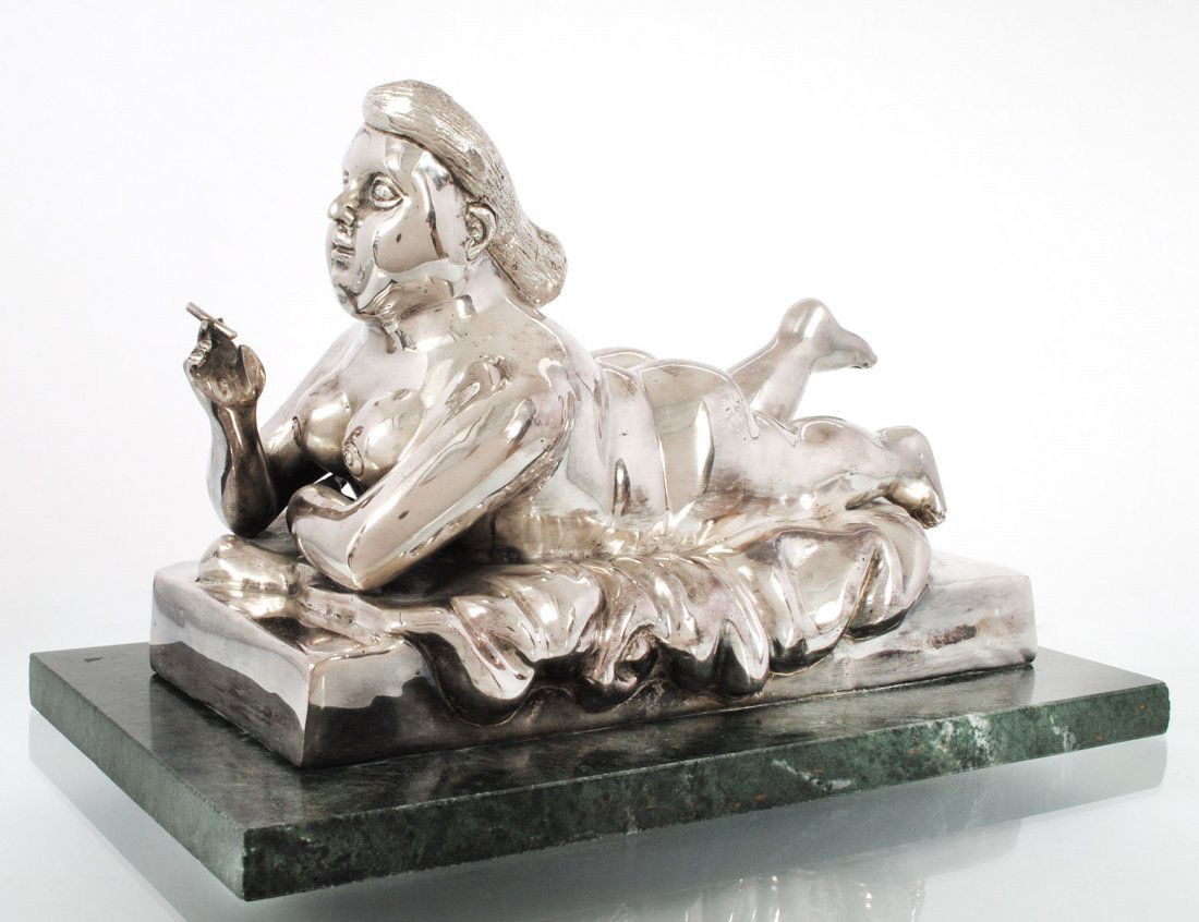 AFTER FERNANDO BOTERO (Colombian. Born 1932): Nude Woman Smoking”. Cast foundry mark. Silvered Bronze. Length 11 5/8”. Mounted on a marble base. (300/400)