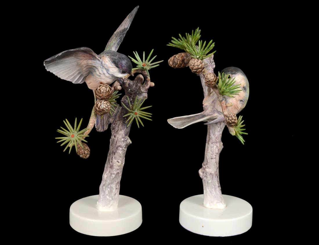 PAIR OF D. DOUGHTY PORCELAIN "CHICKADEE": English. 1938. By Royal Worcester. Heights 8 1/2" and 9 1/2". (Cond: three needles missing) (400/600)