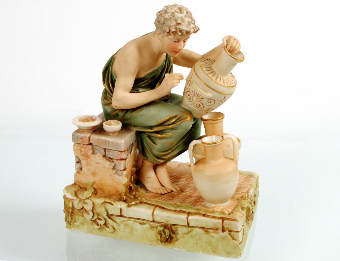 ROYAL DUX PORCELAIN FIGURE OF A POTTER: Bohemian. Molded Model No. 129. Height 7 3/8”. (Cond: chips and loss to brush) (250/350)