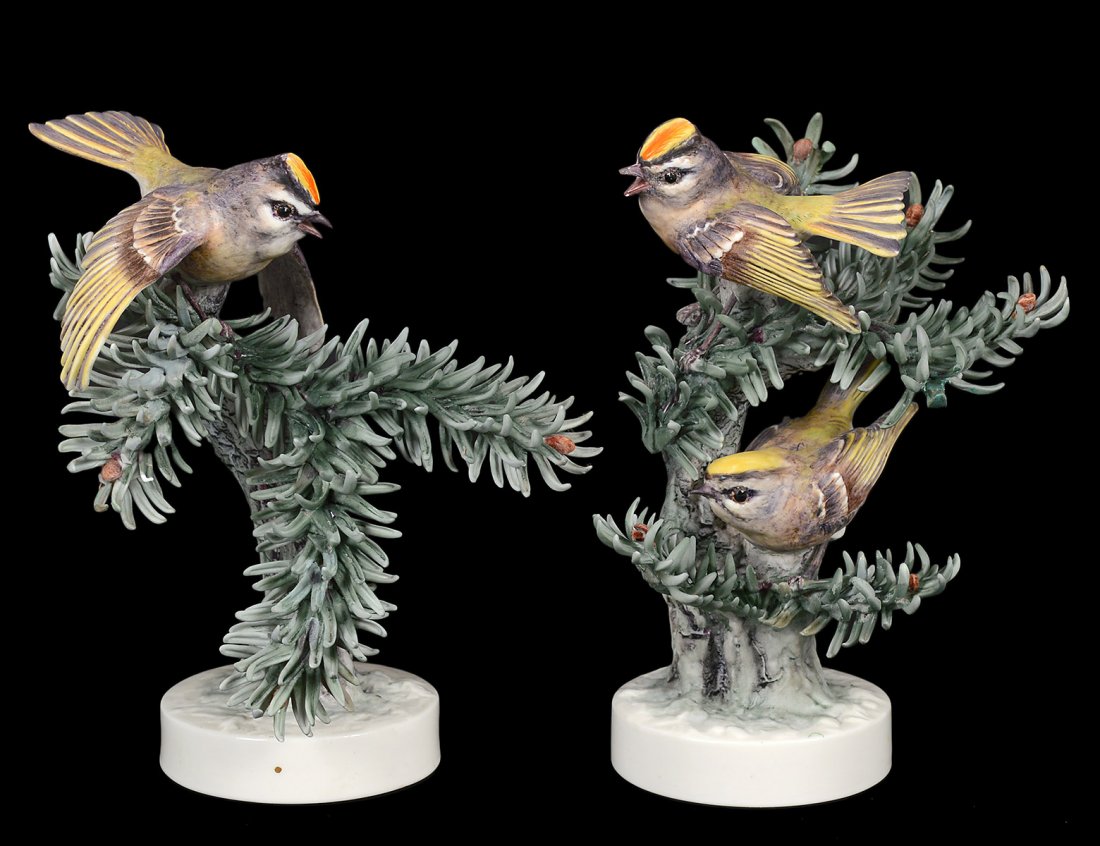 PAIR OF D. DOUGHTY PORCELAIN "GOLDEN CROWNED KINGLET": English. 1951. By Royal Worcester. Limited Edition of 500. Height 7 1/2". (Cond: minor losses to leaves) (400/600)