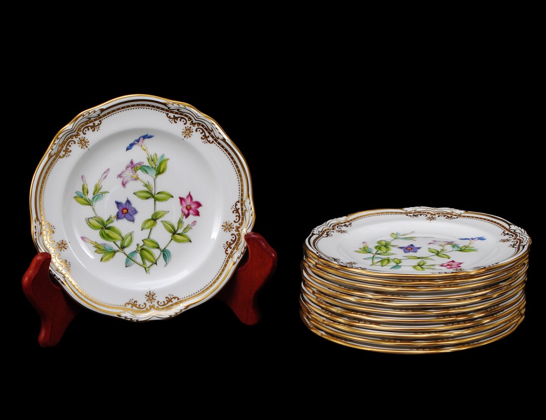 SET OF TWELVE SPODE PORCELAIN BREAD AND BUTTER PLATES: English. In the "Stafford Flowers" pattern. Diameter 6 1/8". (400/500)