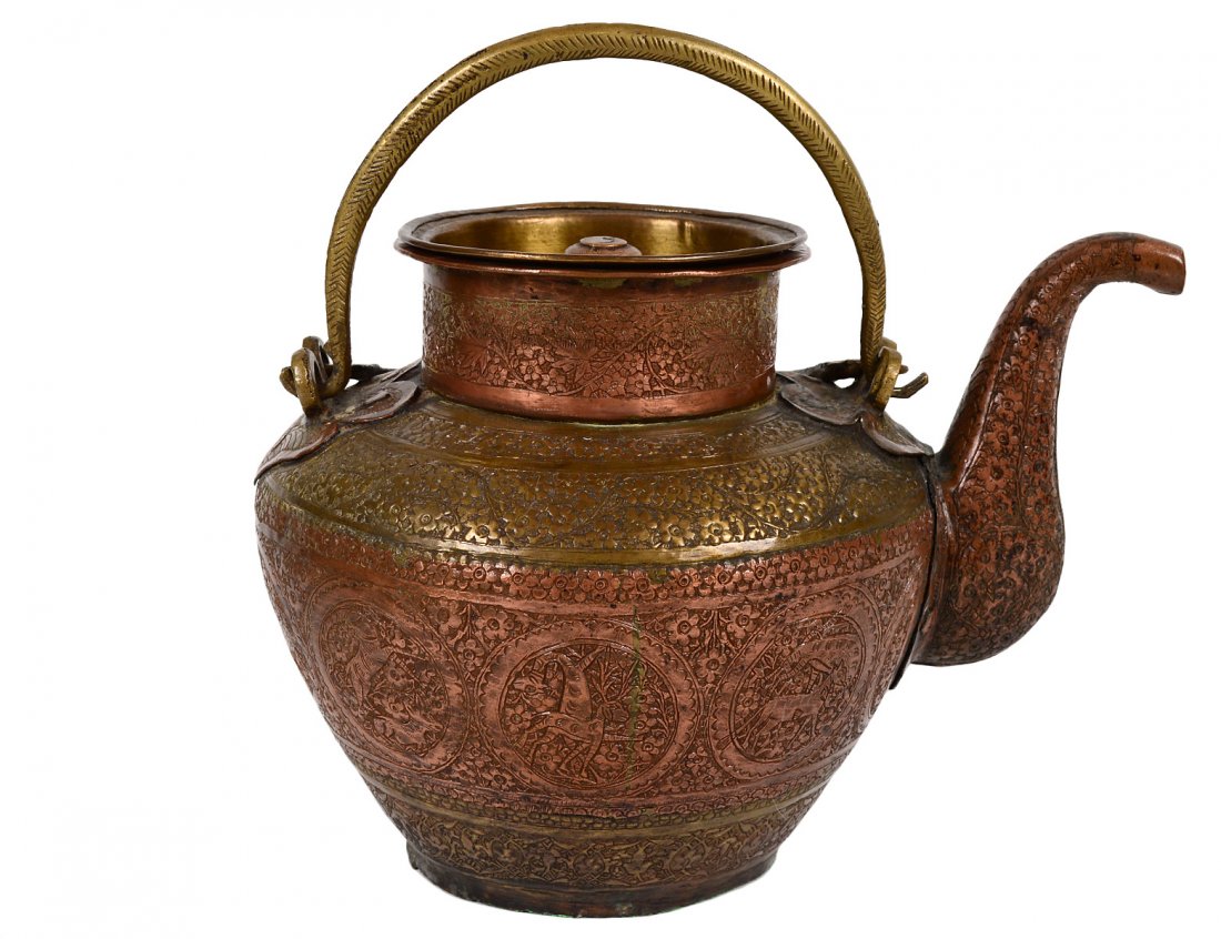 MIDDLE EASTERN HAMMERED BRASS AND COPPER TEA POT: Possibly Ottoman. 18th/19th Century. With double handle. Height 7". (300/400)
