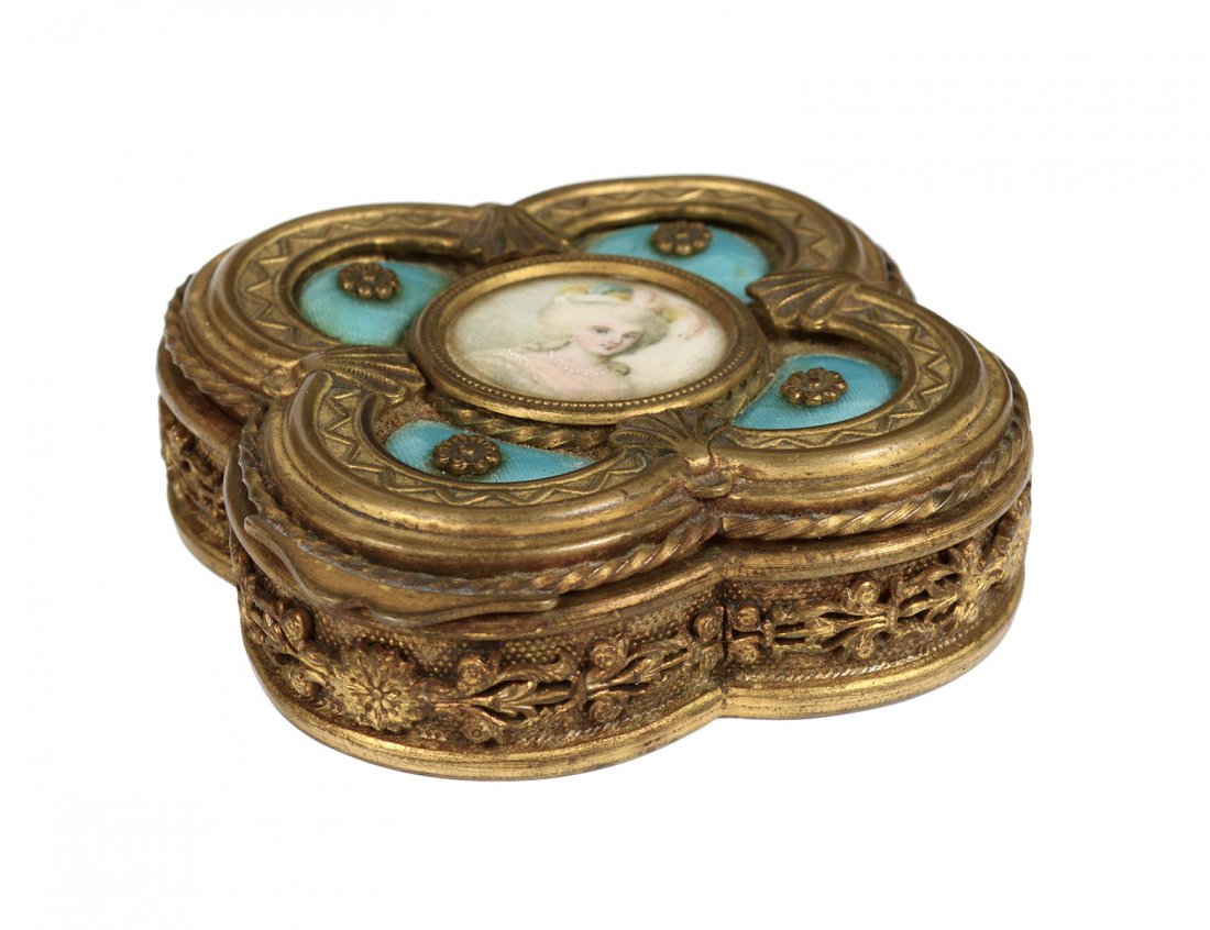 GOOD GILT BRONZE AND ENAMEL JEWELRY BOX: French. 19th Century. The hinged cover centered by a miniature portrait on ivory. Diameter 3 1/4". (400/500)