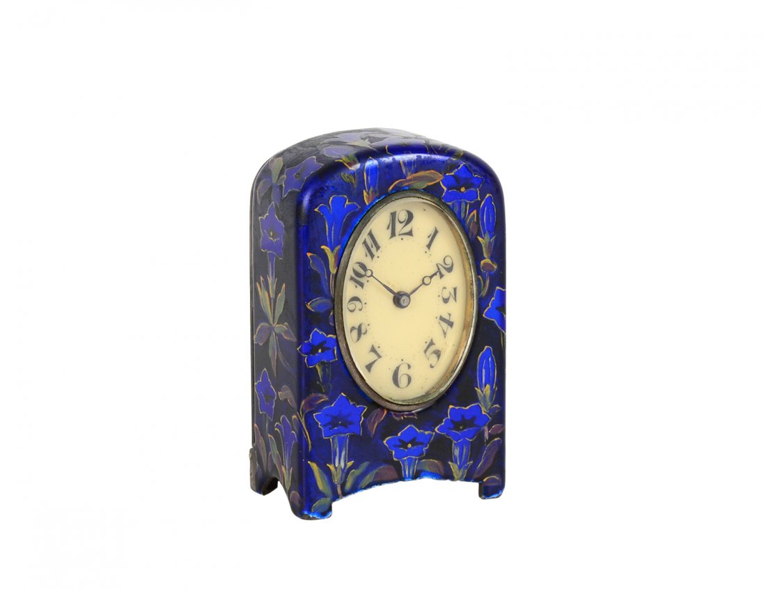 FINE MINIATURE STERLING SILVER AND ENAMEL TABLE CLOCK: Circa 1930. Case stamped .925 and marked Zenith. With oval dial. Height 1 3/4". (300/400)