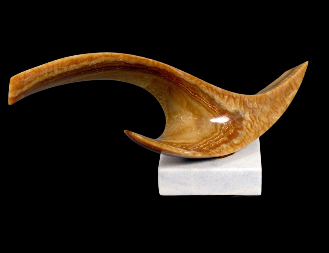 LEONARDO NIERMAN (Mexican. Born 1932): "Contemporary Sculpture". Signed Nierman. Onyx on a Marble Base. Length 25". Height 11 1/8". (800/1200)