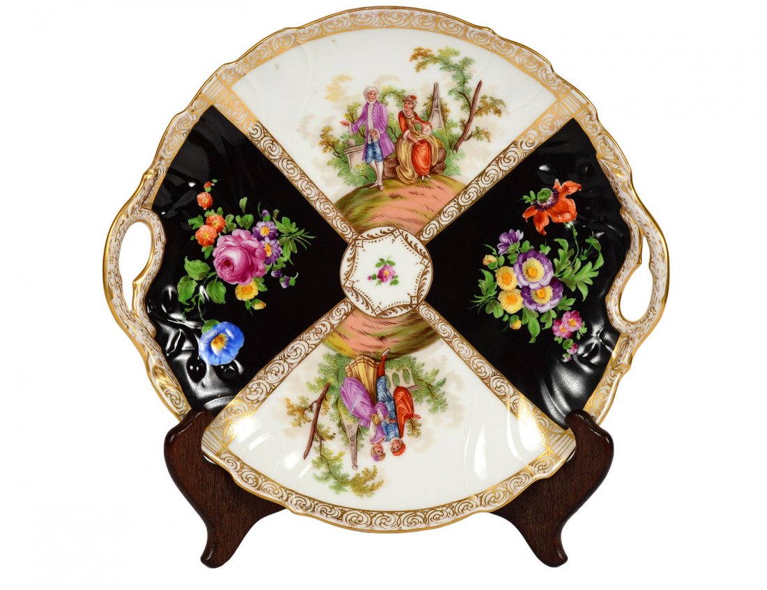DRESDEN PORCELAIN CAKE PLATE: German. Post Second World War. Painted with alternating floral and figural scenes. Diameter 10 1/4". (100/150)