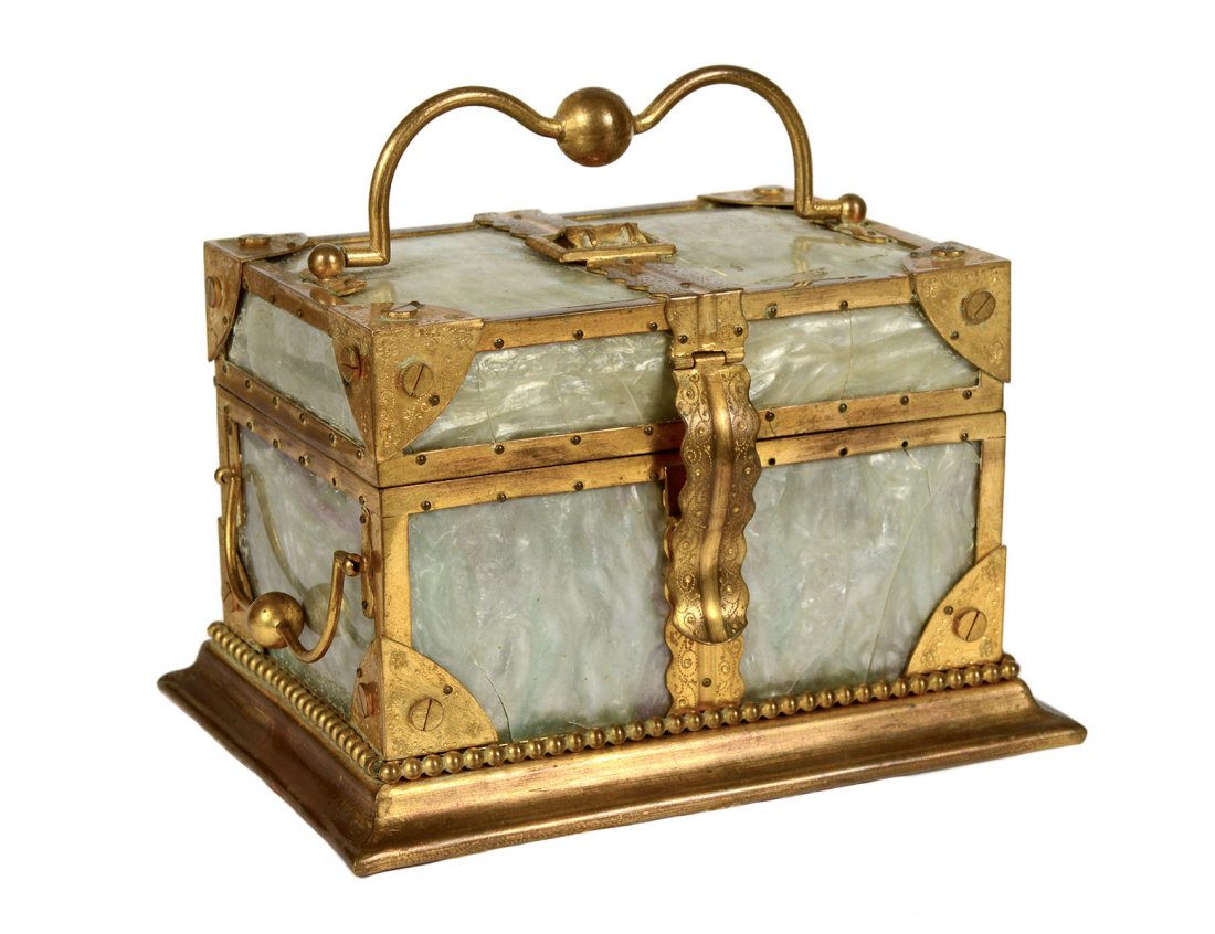 MOTHER OF PEARL AND BRASS PERFUMER: Probably French. Circa 1910. With hinged lid opening to three gilt enameled bottles. Length 5 3/8". (Cond: cracks to mother of pearl and minute chips to bottles) (500/700)