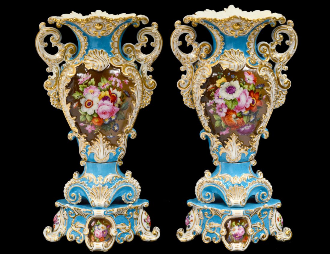 PAIR OF JACOB PETIT PORCELAIN VASES: French. 19th Century. Blue underglaze J.P. Each with scroll handles, painted with reversed floral panels, raised on a conforming base. Height 13 3/4". (1000/1500)