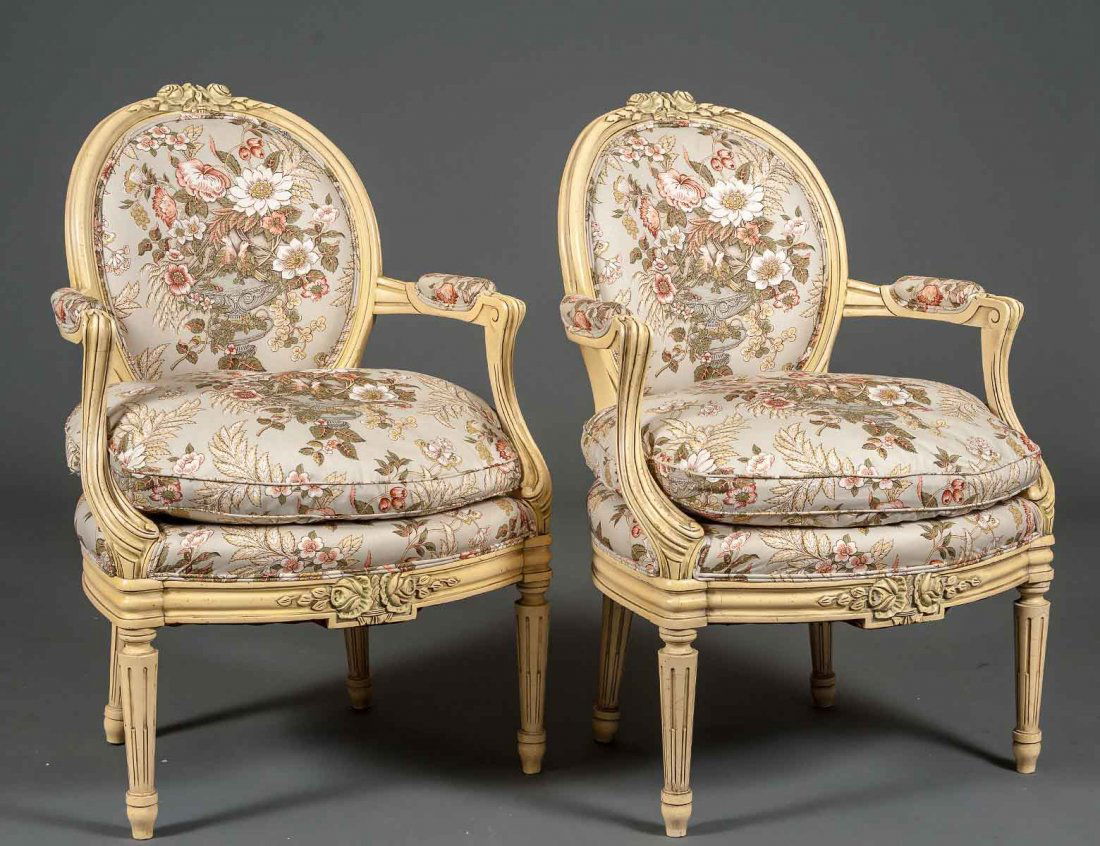 PAIR OF PAINTED LOUIS XVI STYLE FAUTEUILS: Each with padded oval backrest above the seat with loose cushion. Carved with top and front rail. (500/700)