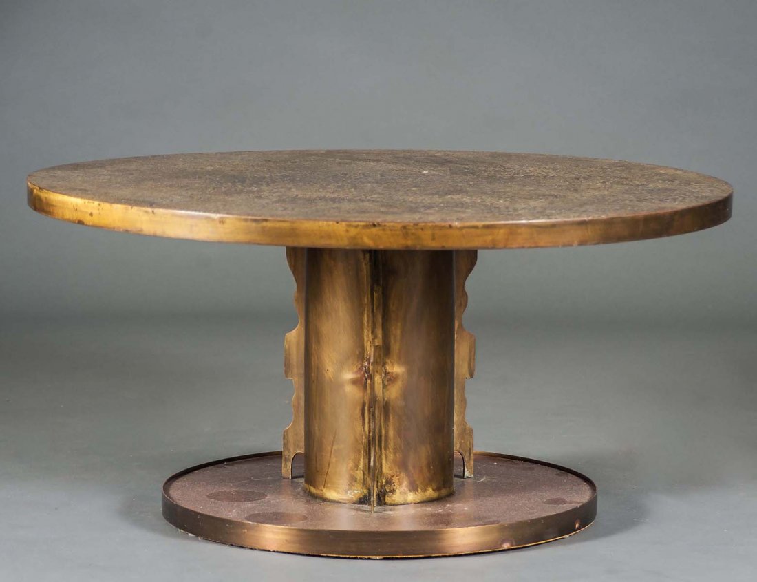 LAVERNE BRONZE AND PEWTER LOW TABLE: American. Circa 1985. In the “Etruscan” pattern. Of circular form supported by a pedestal base. Height 17 ¼”. Diameter 35 ½”. (1500/2500)