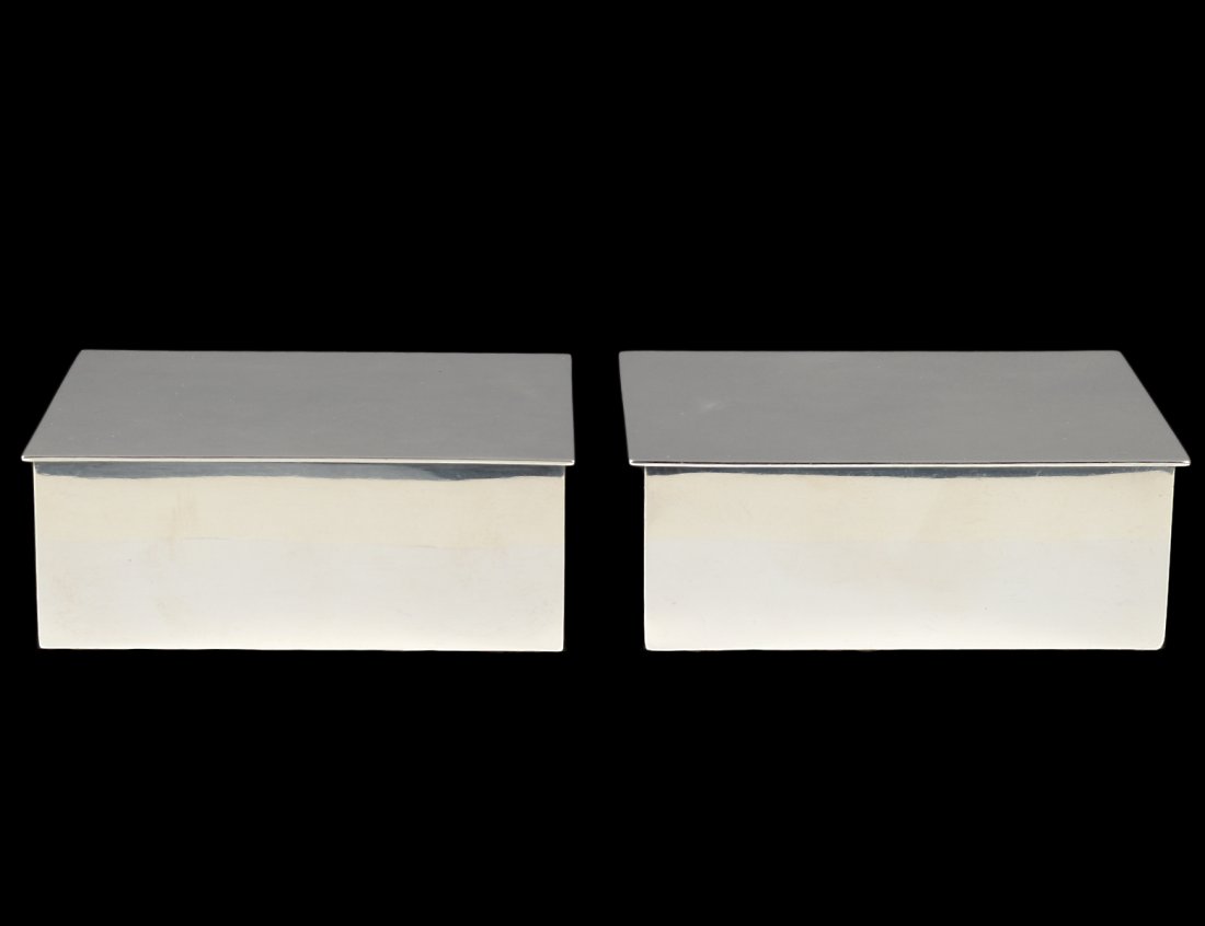 PAIR OF TIFFANY & CO. STERLING SILVER CIGARETTE BOXES: American. Post 1938. Each with wood liner. Length 4 1/4". (200/300)