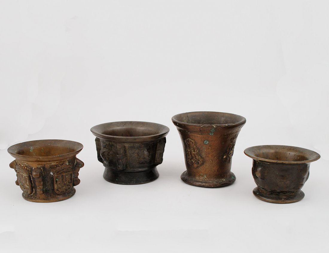 GROUP OF FOUR LATE RENAISSANCE MORTARS: European. 18th Century. Cast with various motifs. Heights 2 5/8" to 4 1/4". (250/350)