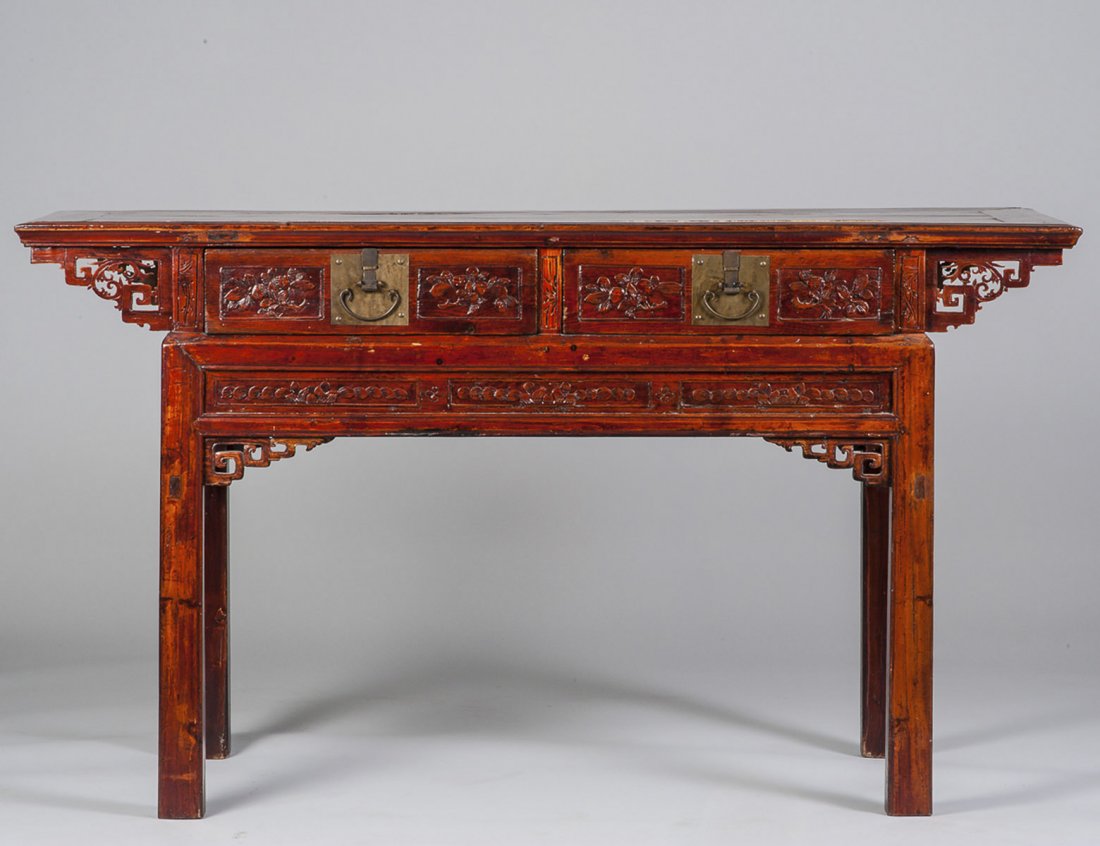 TEAKWOOD ALTAR TABLE: Chinese. Circa 1920. The rectangular top above two metal mounted and carved drawers, raised on square straight legs. Height 34". Width 60 1/4". Depth 19 3/4". (400/500)