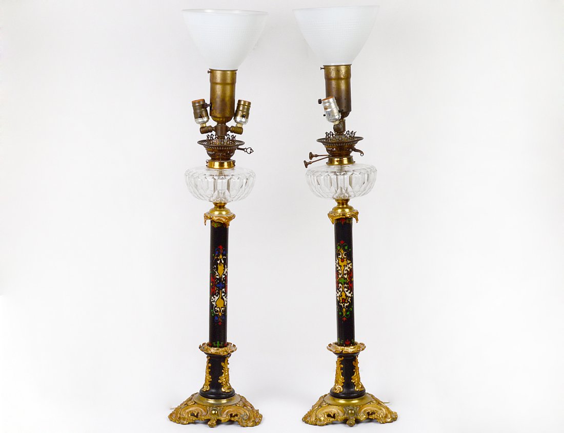 PAIR OF ANTIQUE TOLE AND BRONZE OIL LAMPS: With cut glass fonts. Stamped "Messangers Patent". Height 33 1/2". (100/500)