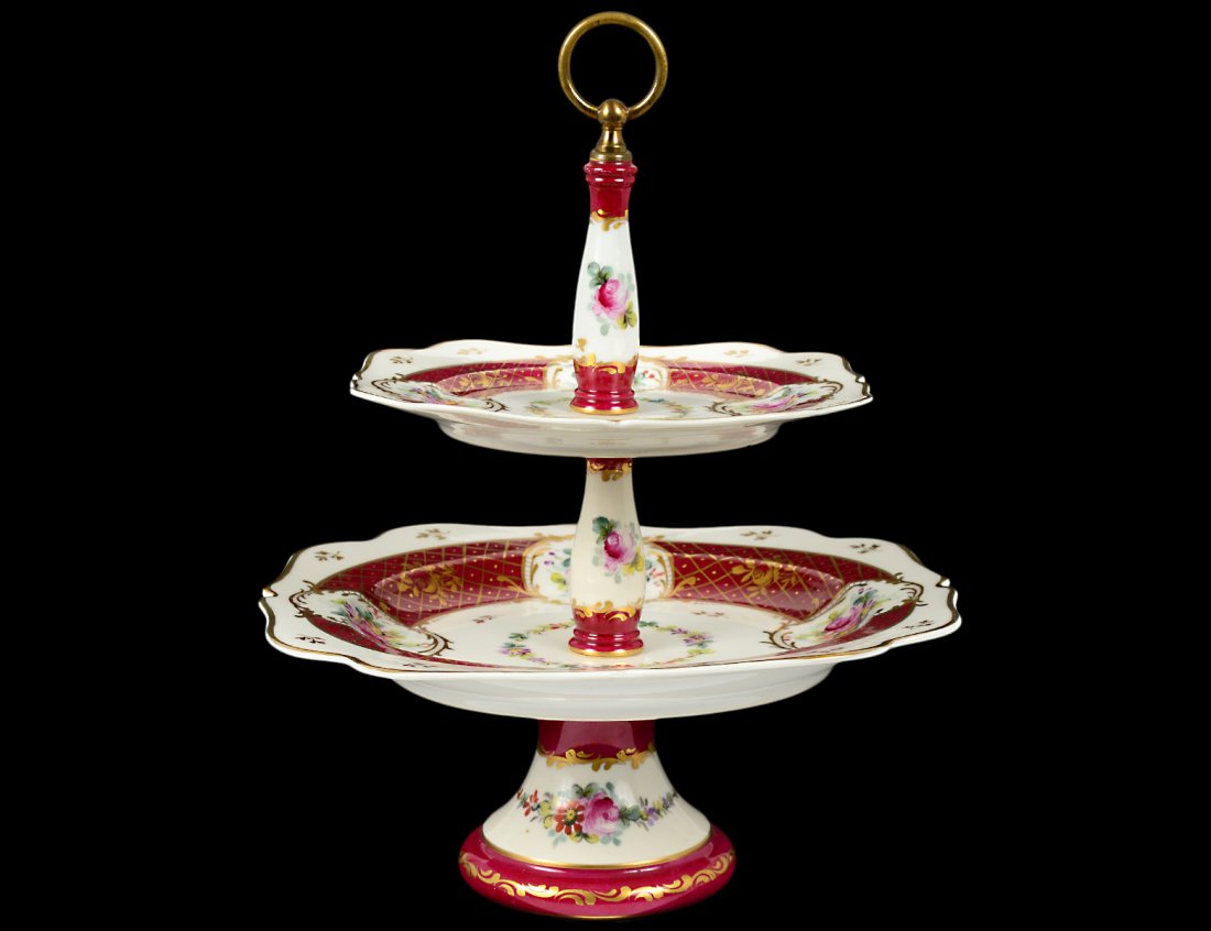 PORCELAIN TWO TIER CAKE STAND: French. Made for Birks, Canada. With hand painted decoration. Height 13". (100/500)